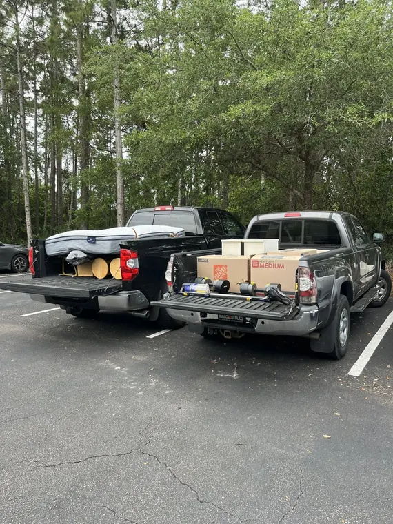 Two trucks loaded and ready to haul away
