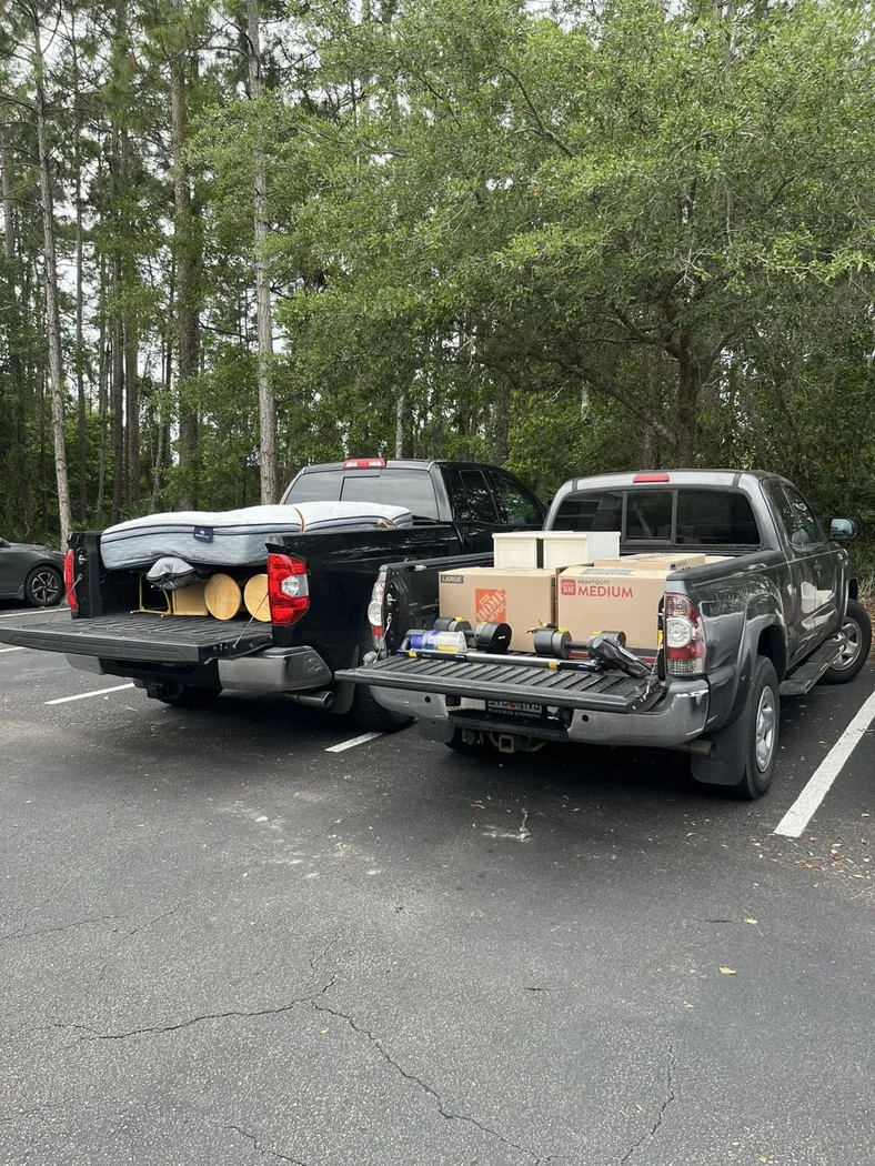 Two trucks loaded and ready to haul away after a garage cleanout