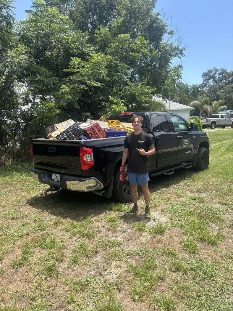 Prime Buck crew loading a truck bed after a pickup